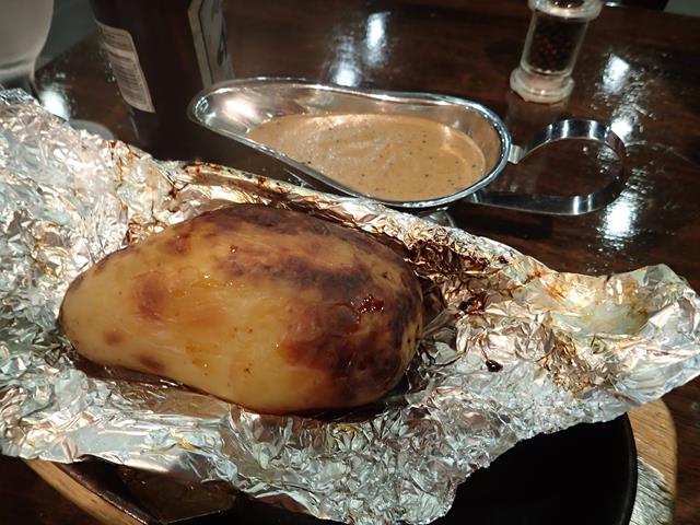 Baked potato and pepper sauce at Squires Loft Restaurant