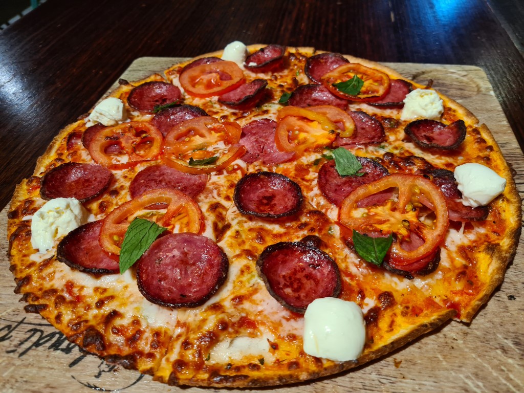 Delicious thin crust pizza at Bondi Pizza Parramatta