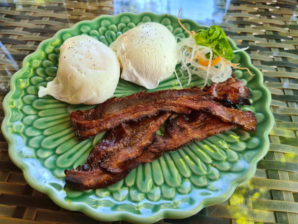 Poached eggs with side of bacon at Wok Wok Restaurant Andaz Bali Resort