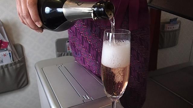 Freshly poured champagne in Garuda Business class