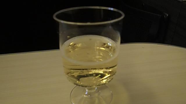 Champagne in a plastic cup on JAL flight