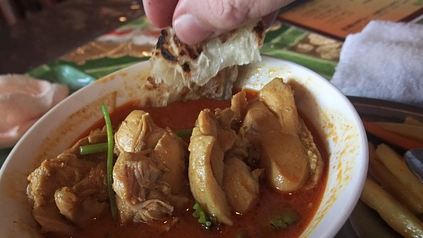 Dip Roti into the Chicken Curry
