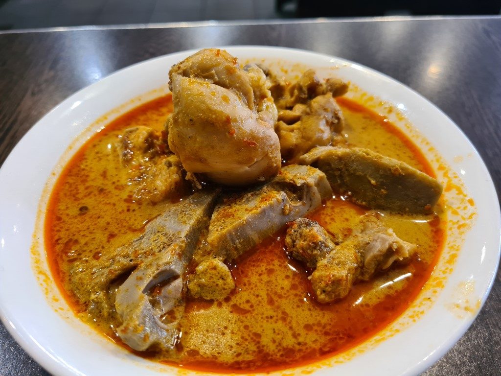 Rich Gulai Ayam chicken curry with coconut sauce and spices at The Sambal Indonesian Restaurant in Sydney CBD