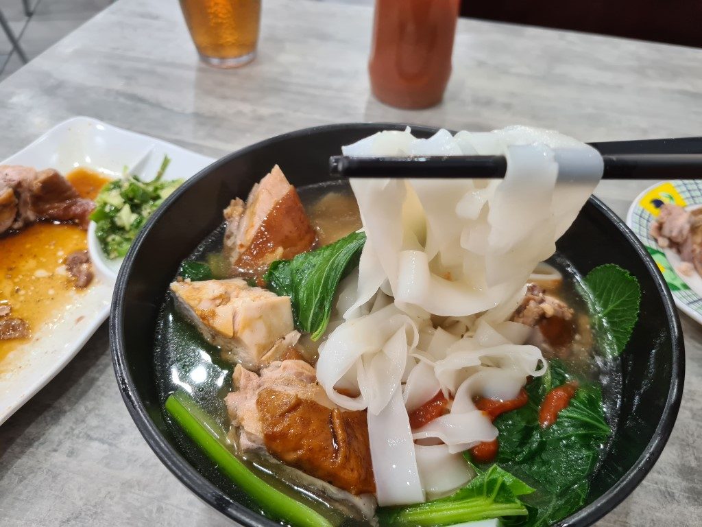 Steaming bowl of rice noodle soup at Sun Ming BBQ Restaurant Parramatta – tender BBQ pork or meat in savoury broth with rice vermicelli noodles and fresh greens, authentic Cantonese comfort food, Church Street