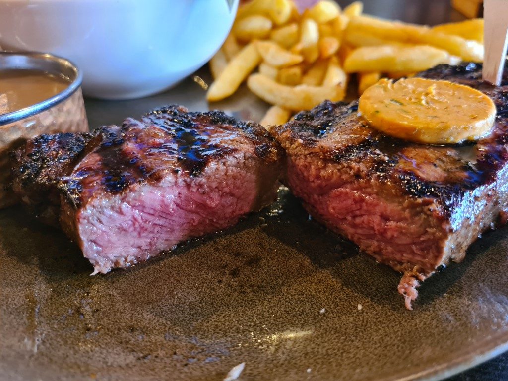 Eye fillet steak cooked medium and sliced open at Volcano's Steakhouse Parramatta – perfect pink centre, Halal beef