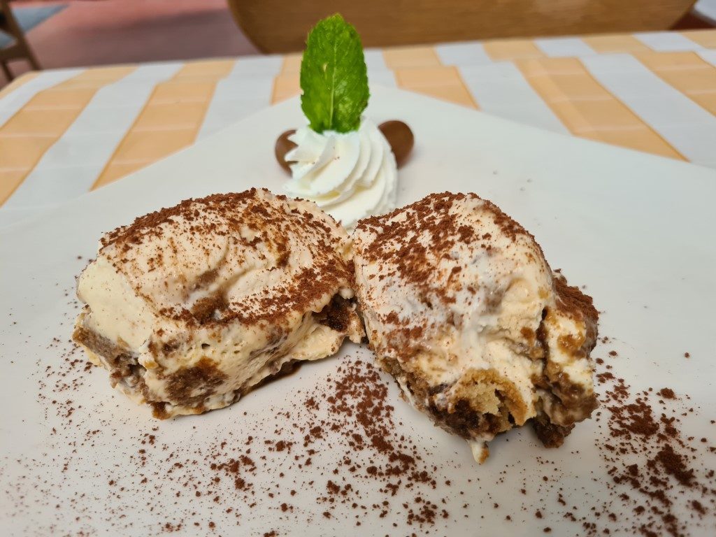 Delightful classic Tiramisu dessert with mascarpone cream and cocoa dusting at Pizzeria Limoncello Italian Restaurant on Soi 11 Sukhumvit, Bangkok