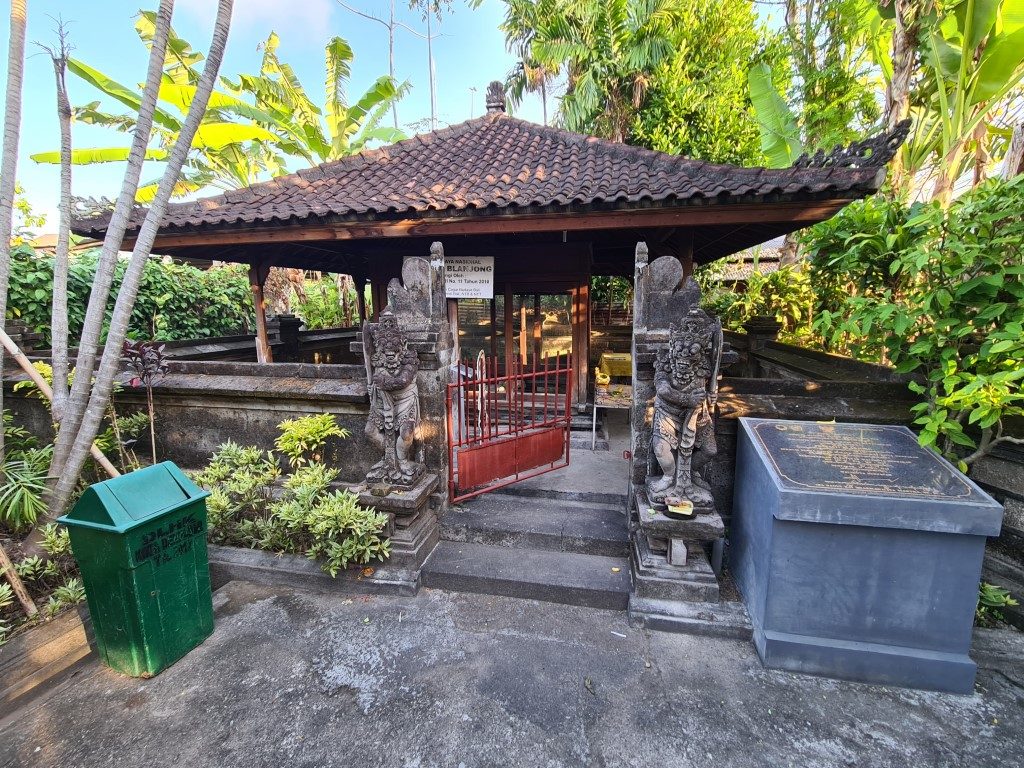 Wooden enclosure protecting Belanjong Pillar in Sanur Bali