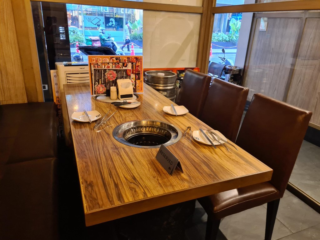 Built in BBQ tables at Gyu-Kaku Japanese BBQ Restaurant Bangkok