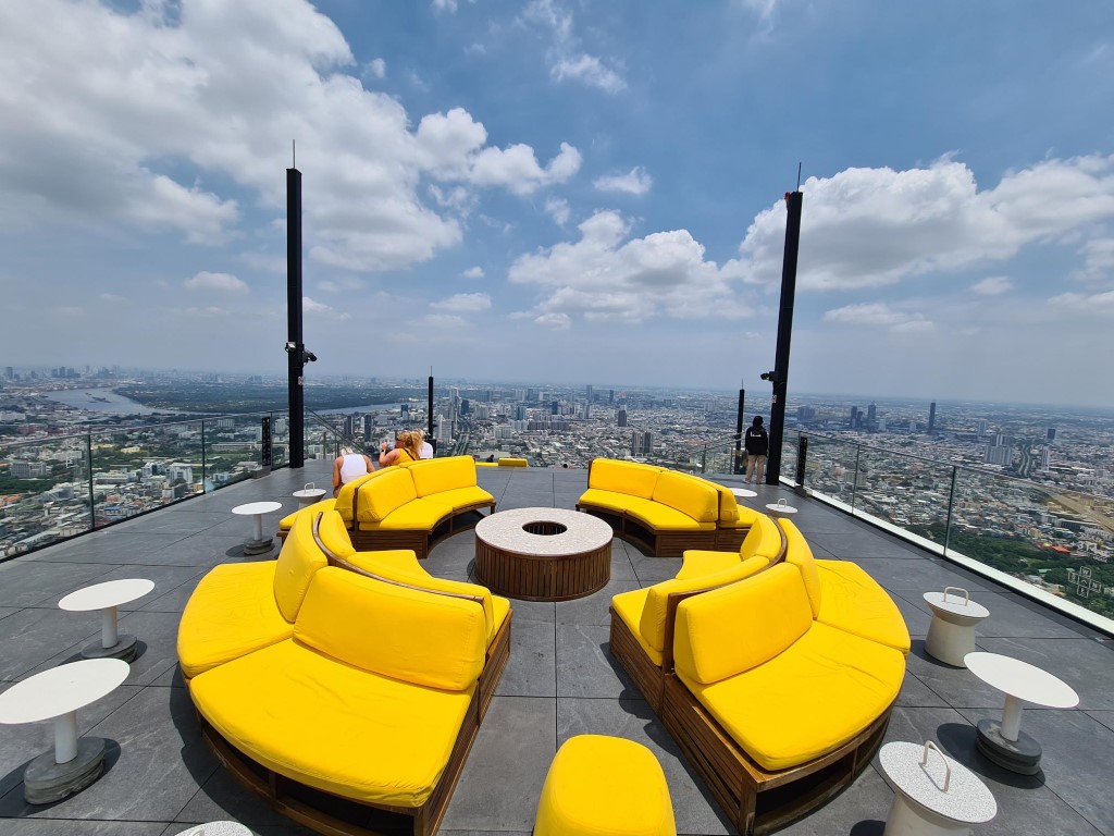 Seating at the very top of Manahakon Skywalk Bangkok