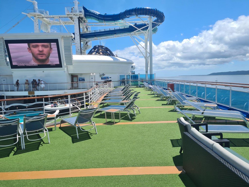 Walking past Deck Chairs on P&O Pacific Adventure